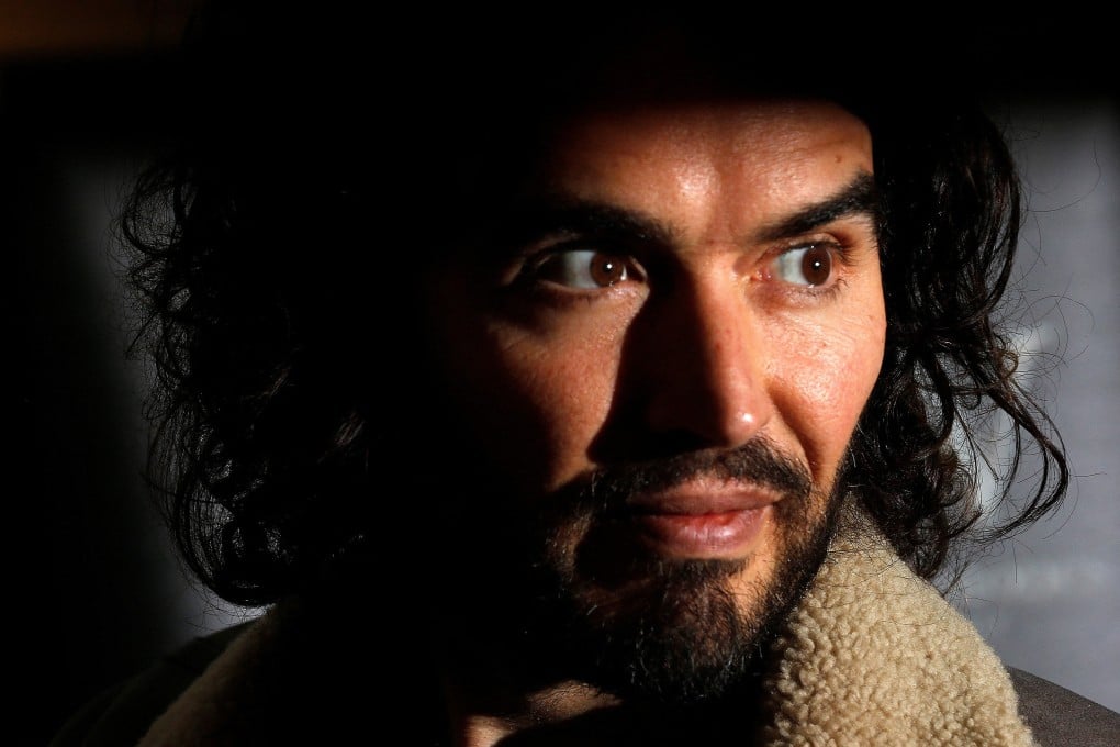 UK comedian Russell Brand poses for photographers before signing copies of his new book in London in December 2014. Photo: Reuters