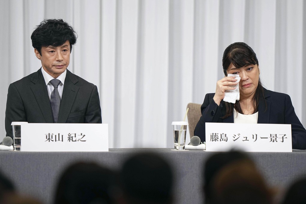 Julie Keiko Fujishima, former president of Johnny and Associates, wipes away tears during a Tokyo press conference on September 7, amid allegations of child sexual abuse by the agency’s late founder and her uncle, Johnny Kitagawa. Beside her is the agency’s new president, Noriyuki Higashiyama. Photo: Kyodo
