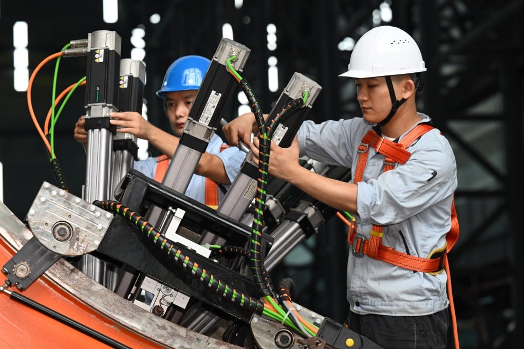 Staff members test equipment at the Comprehensive Research Facility for Fusion Technology (CRAFT) in east China’s Anhui province. Photo: Xinhua