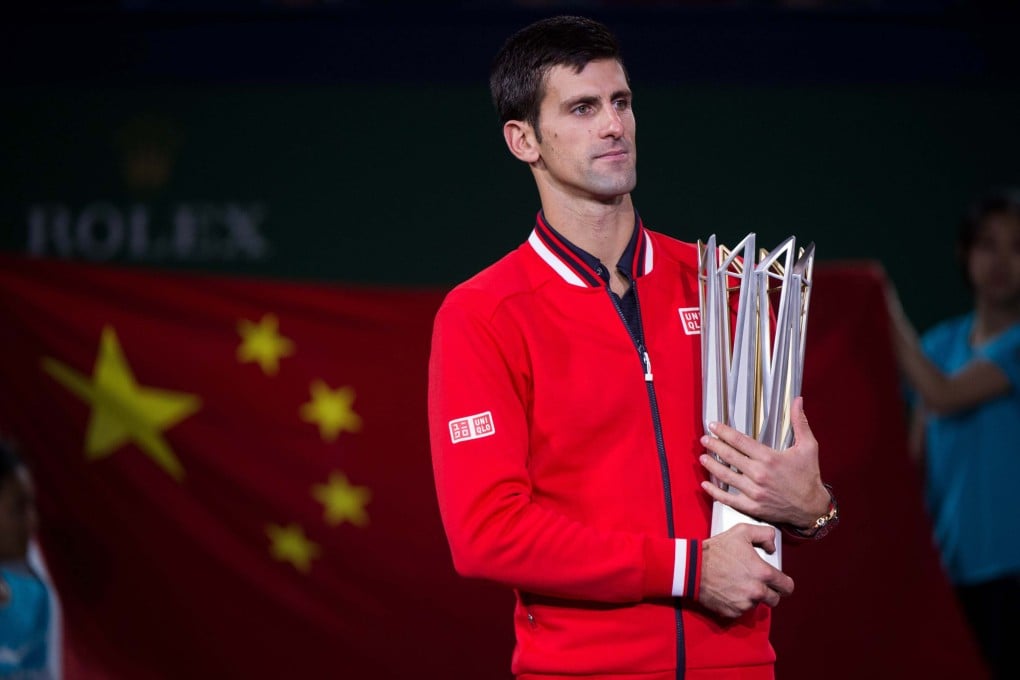 Novak Djokovic holds his trophy after winning the 2015 Shanghai Masters final. Photo: AFP