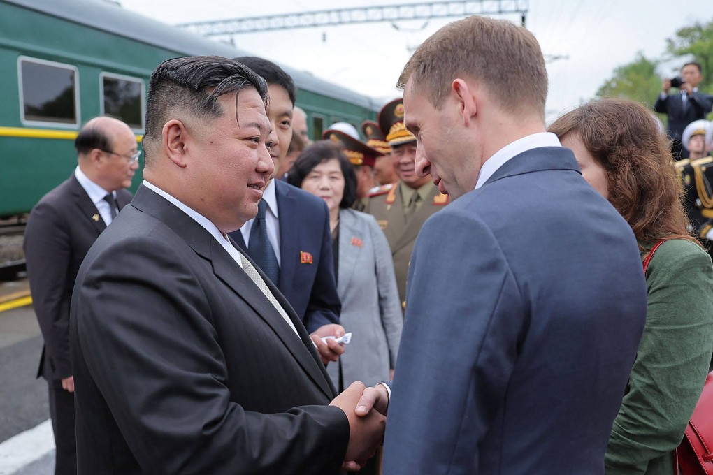 North Korea’s Kim Jong-un shakes hands with Russian natural-resources minister Alexander Kozlov during a farewell ceremony at a railway station near Vladivostok. Photo: KCNA VIA KNS / AFP