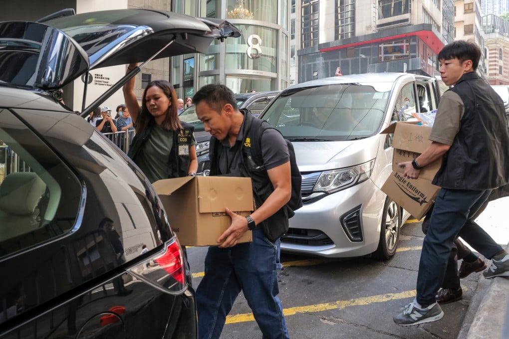 Police loading gathered evidence into a vehicle after arresting and raiding the office of influencer Joseph Lam, who had touted JPEX products. Photo: Jelly Tse