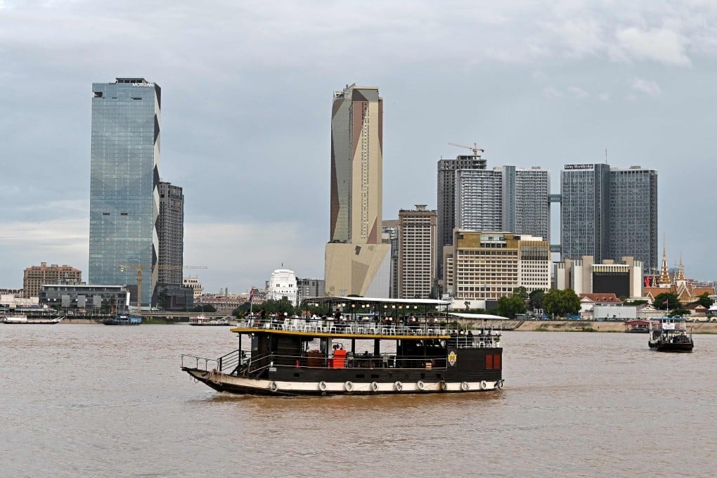 A tourist boat sails along the Mekong river in Phnom Penh, Cambodia. Photo: AFP