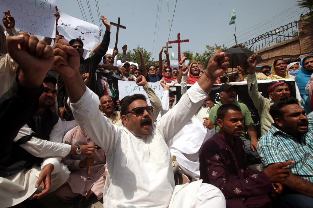 Members of Pakistan’s Christian community shout slogans during a protest last month against sectarian mob violence in Punjab. Photo: EPA-EFE