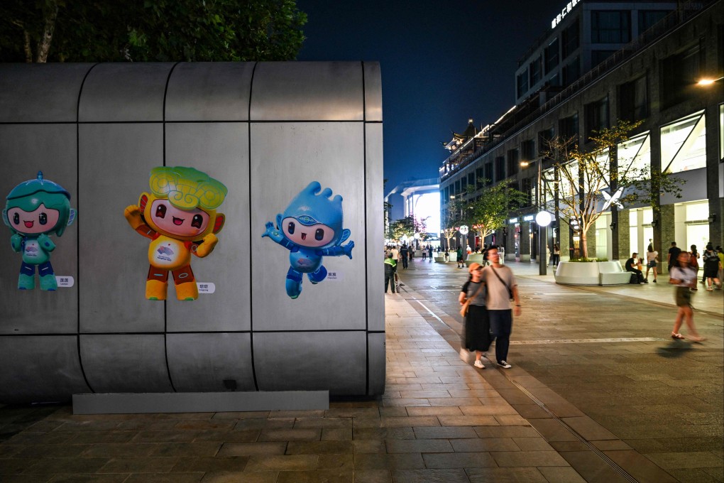 Asian Games’ mascots are seen on a shop’s wall in Hangzhou. Photo: AFP