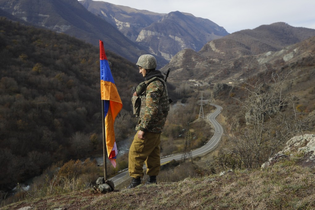 An Armenian soldier stands guard in the separatist region of Nagorno-Karabakh, where Azerbaijan has announced an “anti-terrorist operation” targeting Armenian military positions. File photo: AP