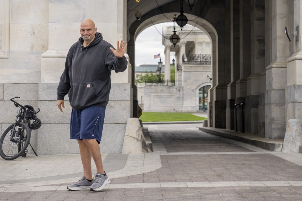 US Senator John Fetterman waves to members of the media on Capitol Hill in April. Photo: AP