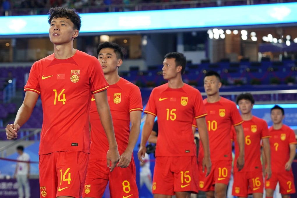 China’s players walk onto the pitch at the start of their group A first-round match against India at the 19th Asian Games in Hangzhou, in Zhejiang province, on September 19. China has focused on ridding the sport of corruption, with little attention paid to how its football performance can be improved. Photo: Xinhua