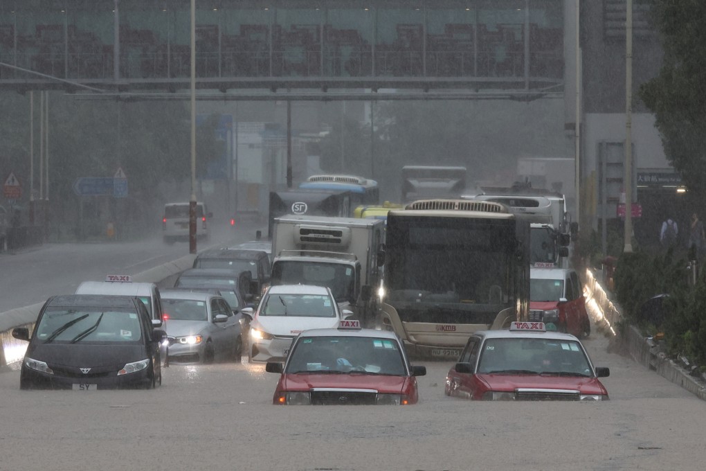 Vehicles on Lung Cheung Road in Wong Tai Sin, which was flooded during heavy rains on September 8. Recent severe weather underscores the need for businesses to go beyond making superficial sustainability efforts while focusing on increasing profits. Photo: Edmond So