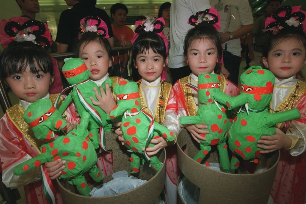 Children throw models of Lap Sap Chung into rubbish bins at the opening of the Clean Hong Kong Campaign in Hang Hau, Sai Kung in July 2001. Photo: Dickson Lee