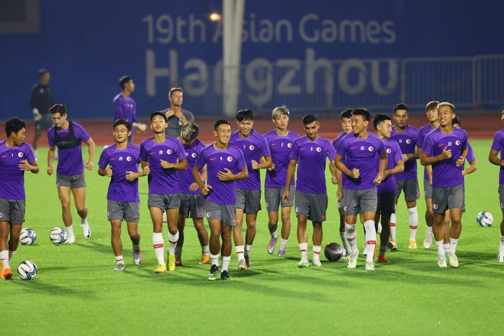 Hong Kong’s players warm-up before a training session at Huanglong Sports Centre Stadium, Hangzhou. Photo: Dickson Lee