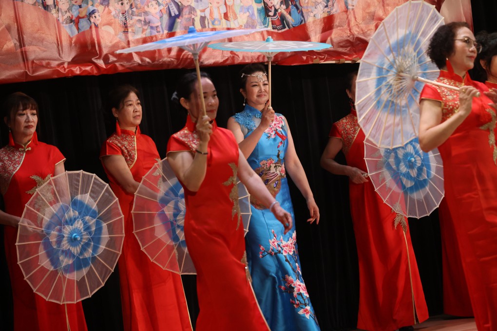 Women wear cheongsam while performing during an event at the Sai Ying Pun Community Complex in Hong Kong on April 10, 2023. Photo: May Tse
