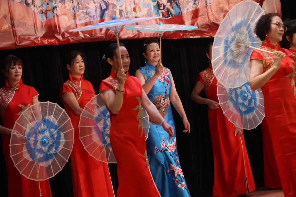 Women wear cheongsam while performing during an event at the Sai Ying Pun Community Complex in Hong Kong on April 10, 2023. Photo: May Tse