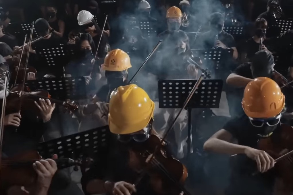 An orchestra in helmets and gas masks performs “Glory to Hong Kong”, which became the anthem of the 2019 protests. Photo: YouTube