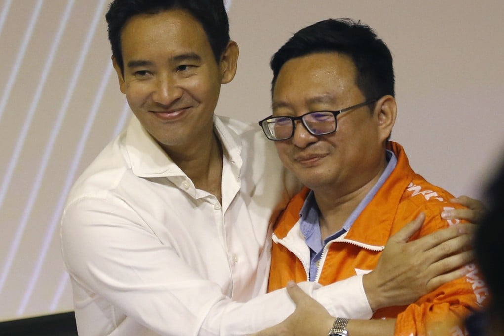 The new leader of the Move Forward Party, Chaithawat Tulathon, right, is congratulated by the chairman of party advisory committee Pita Limjaroenrat after he won a vote for the new party leadership in Bangkok. Photo: EPA-EFE