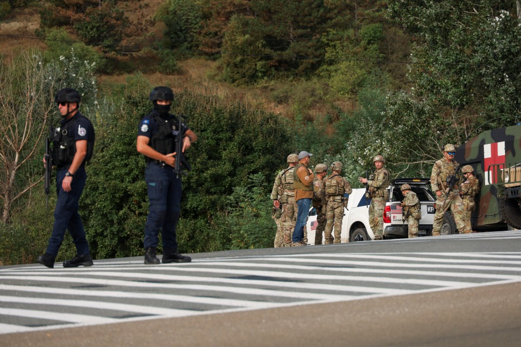 Kosovo police and US and EU troops stand by after a police officer was killed and another was hurt in Kosovo gunfire on Sunday. Photo: Reuters