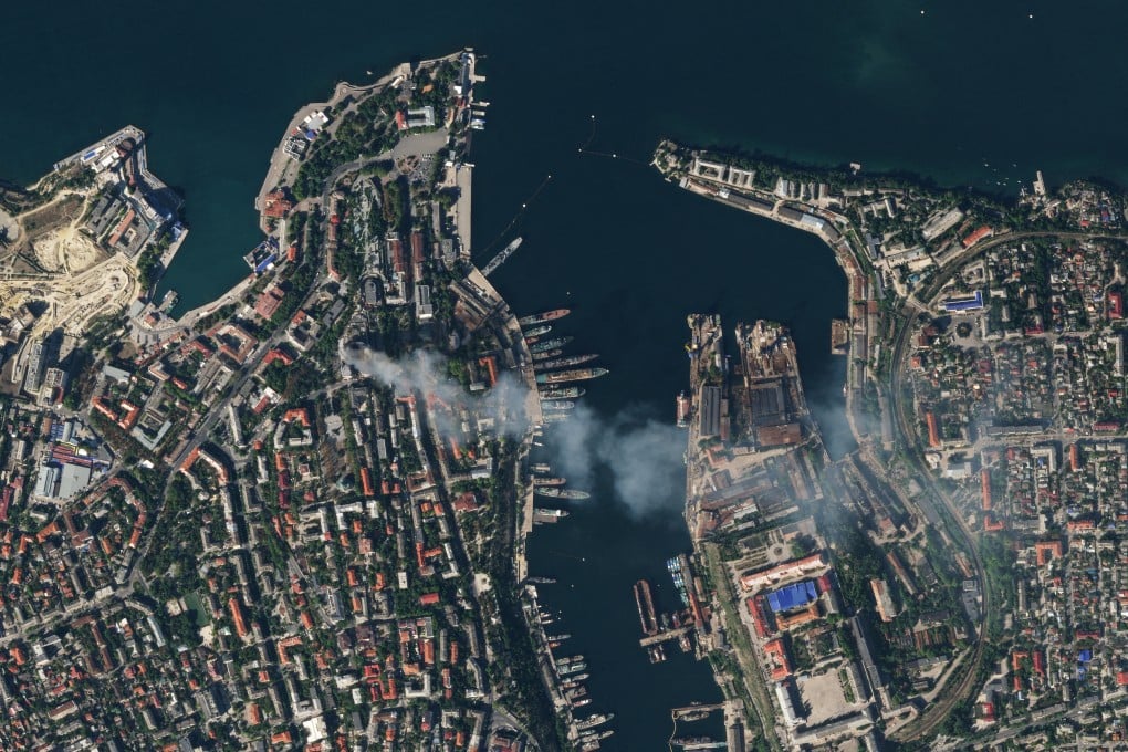A satellite image shows smoke billowing from a Russian Black Sea Navy HQ after a missile strike, as Russia’s invasion of Ukraine continues. Photo: Reuters