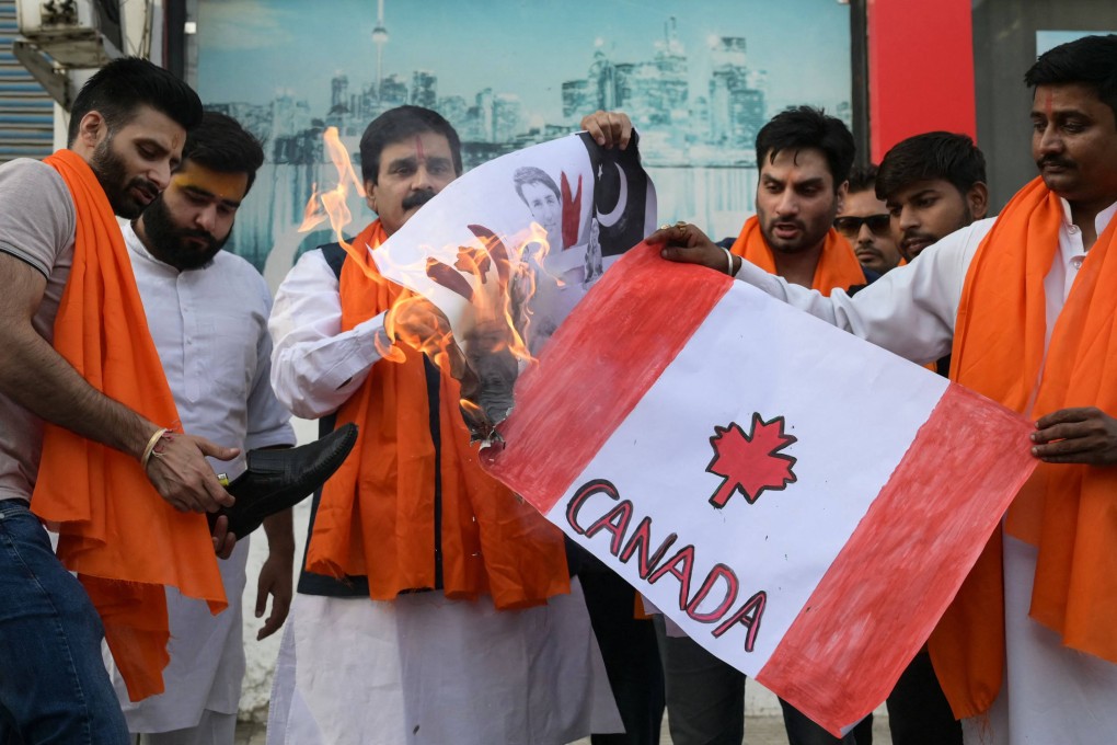Hindu ultranationalists set fire to banners depicting Canada’s national flag and Prime Minister Justin Trudeau during a rally in Amritsar on Saturday. Photo: AFP