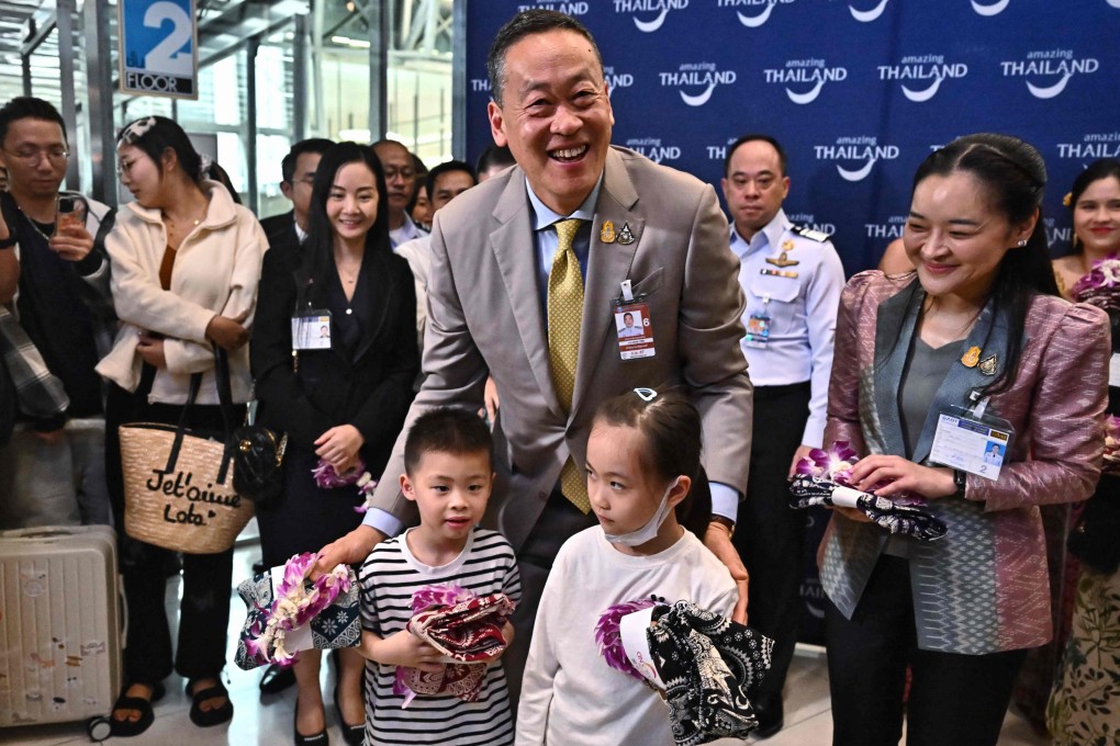 Thailand’s Prime Minister Srettha Thavisin (centre) welcome Chinese tourists with gifts as they arrive at Suvarnabhumi International Airport in Bangkok on Monday, the first day of a visa-waiver scheme for Chinese nationals. Photo: AFP
