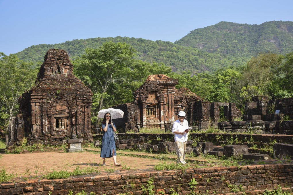 Visitors at the restored My Son Sanctuary in Central Vietnam near Hoi An. A recently completed restoration cleared the ancient complex of weeds and debris and fortified its crumbling towers. Photo: Ronan O’Connell