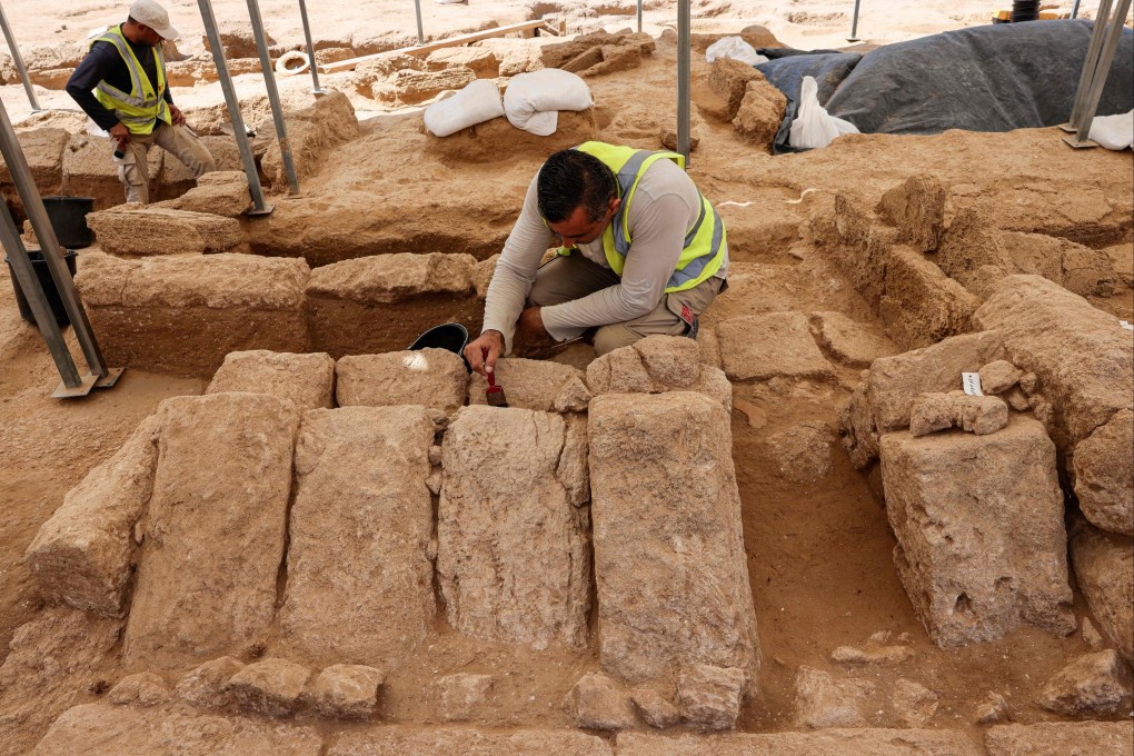 A worker brushes blocks of stone as excavations continue at the site of a cemetery dating from the Roman era, in Beit Lahia in the northern Gaza Strip on Thursday. Photo: AFP