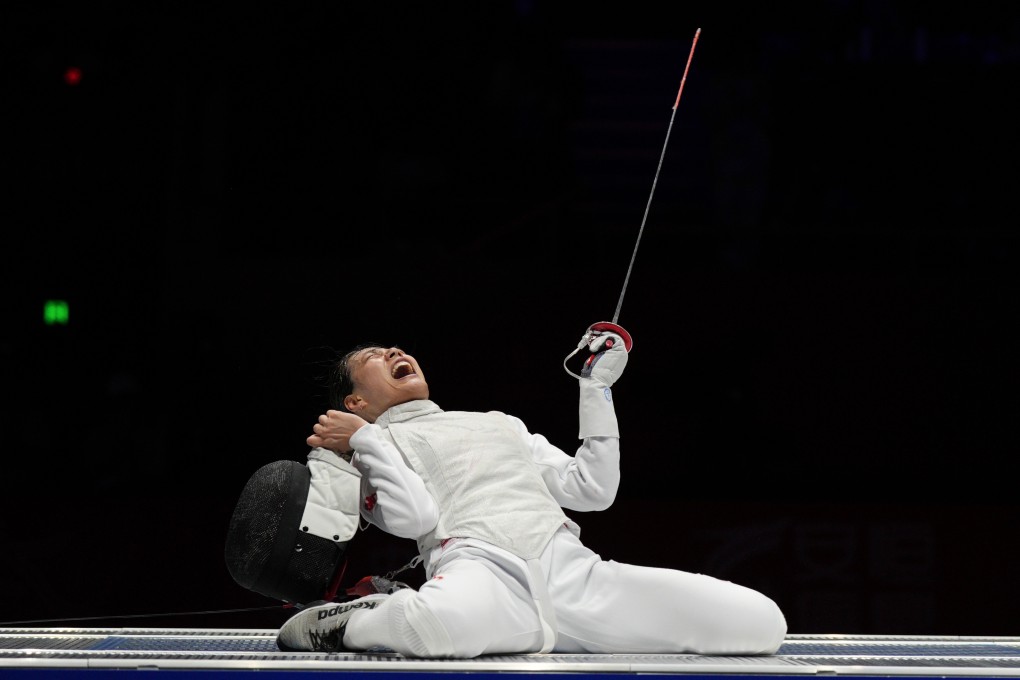 China’s Huang Qianqian, reacts after winning the women’s foil final against Japan’s Ueno Yuka on Monday. Photo: AP