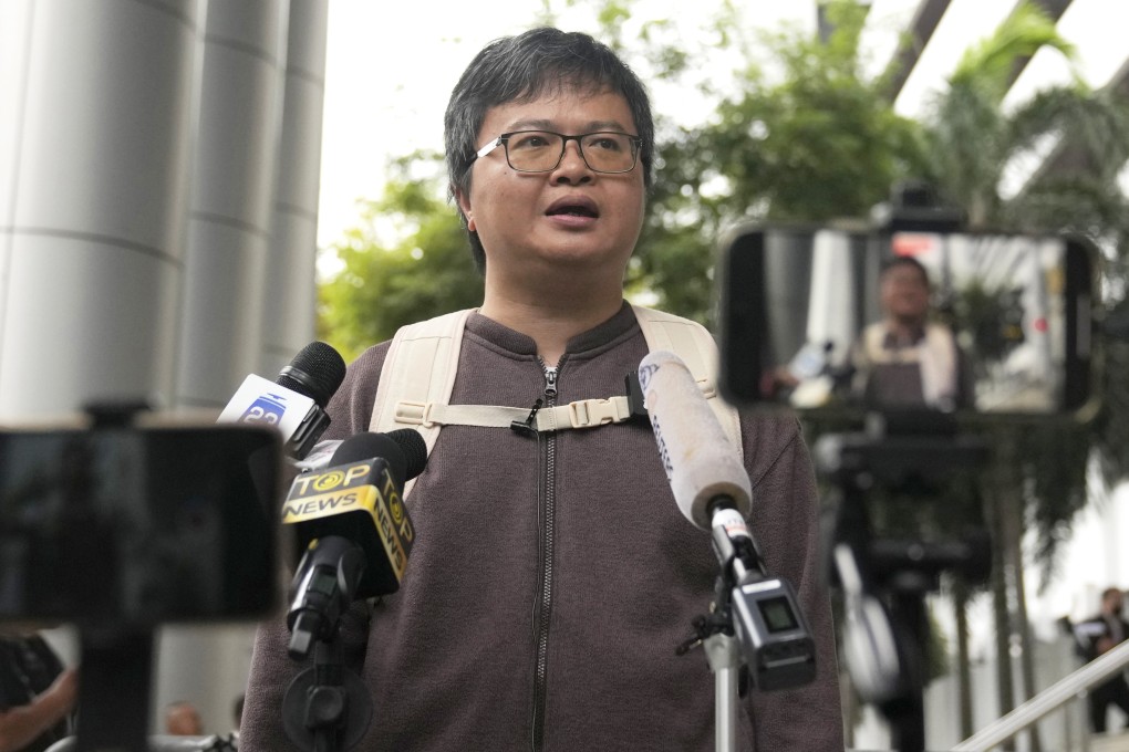 Arnon Nampa talks to the media before entering court to hear the verdict in his royal defamation trial in Bangkok on Tuesday. He was later sentenced to four years in prison for a speech he gave in 2020. Photo: AP