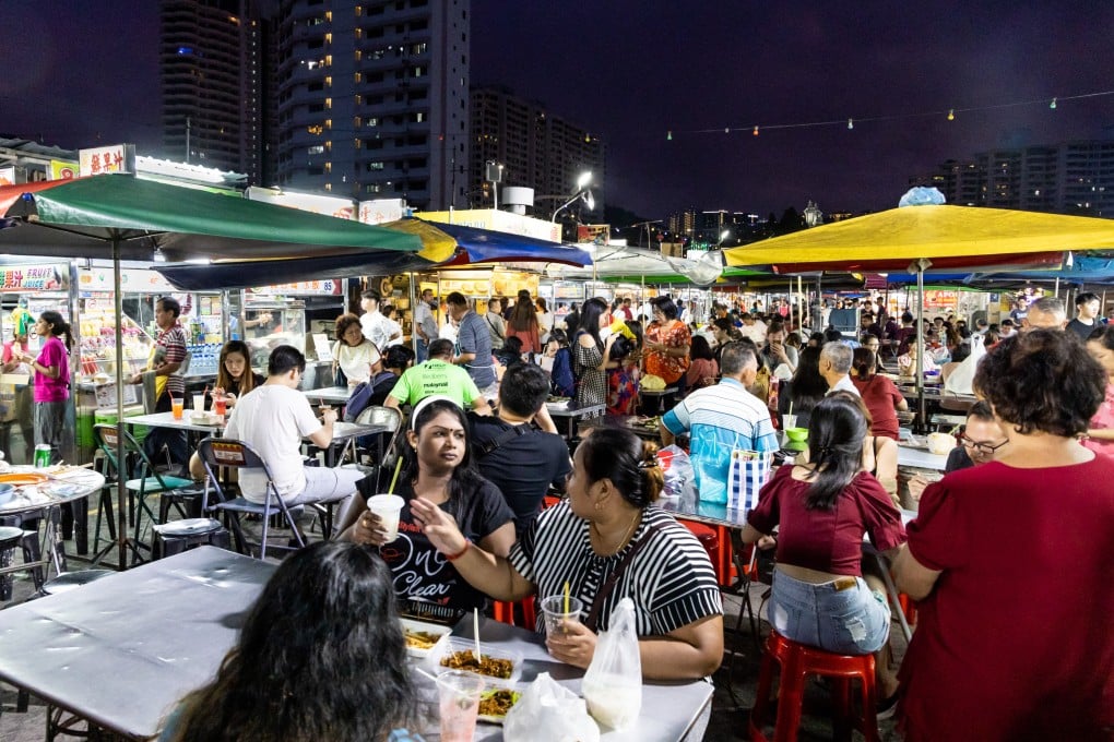 People dine in Penang. Malaysia’s world-famous street food culture partly stems from providing quick, cheap meals for workers to eat on the go. Photo: Shutterstock