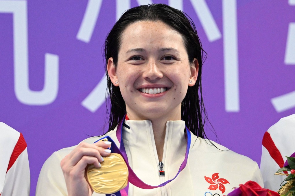 Hong Kong gold medallist Siobhan Haughey smiles after winning the women’s 100m freestyle at the Asian Games. Photo: AFP