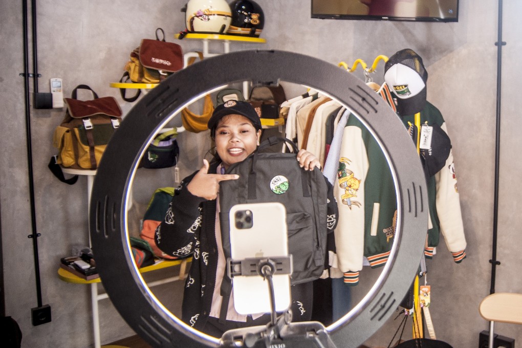 A merchant promotes a bag via live-streaming on TikTok in Yogyakarta, Indonesia. Photo: Xinhua