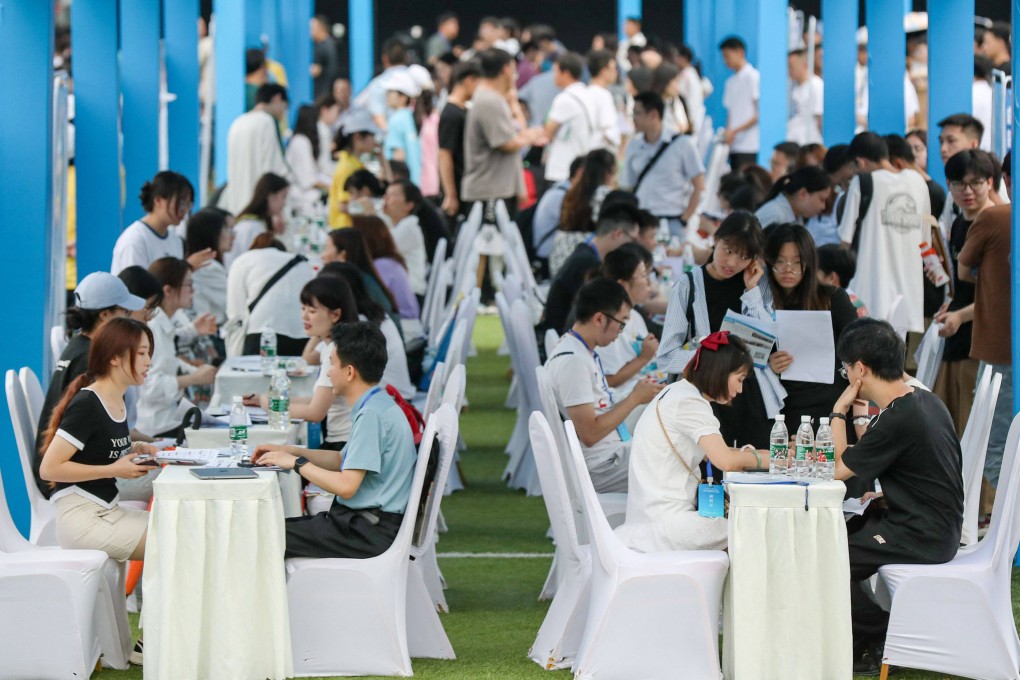 University graduates attend a job fair in Yibin, in China’s southwestern Sichuan province, on June 14. The rise of jobless young people in China is less concerning when compared to OECD countries like Spain, Italy and Sweden, where youth unemployment rates have hovered around 20 per cent for many years. Photo: AFP