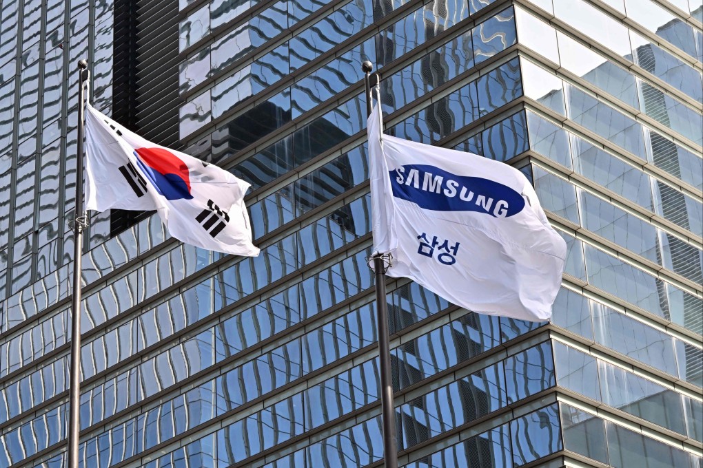 A South Korean national flag and a Samsung flag flutter outside the company’s building in Seoul. Photo: AFP