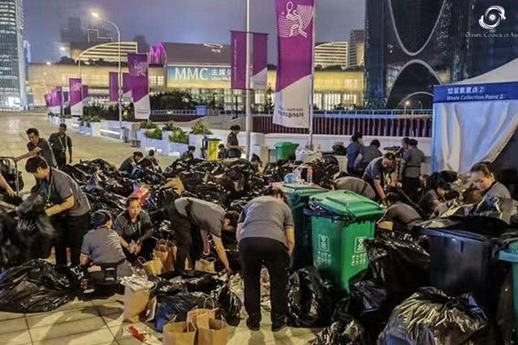 Asian Games volunteers search through rubbish bags for a 12-year-old Hong Kong chess athlete’s lost mobile phone. Photo; Twitter/Asian Games