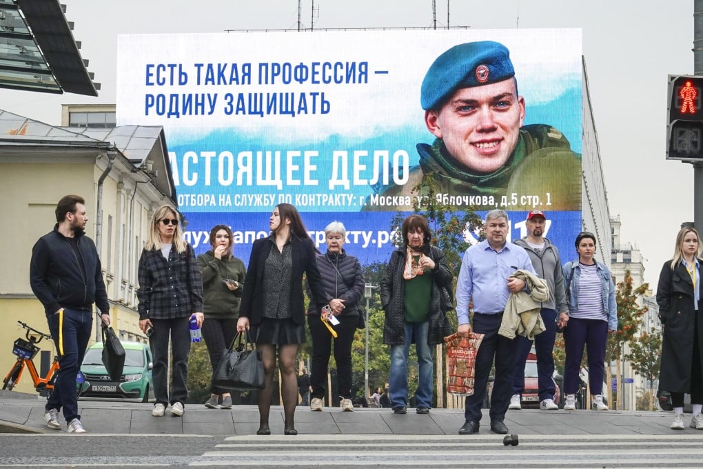 A military conscription billboard in Moscow. Russia said that it planned to raise defence spending by almost 70 per cent next year. Photo: EPA-EFE