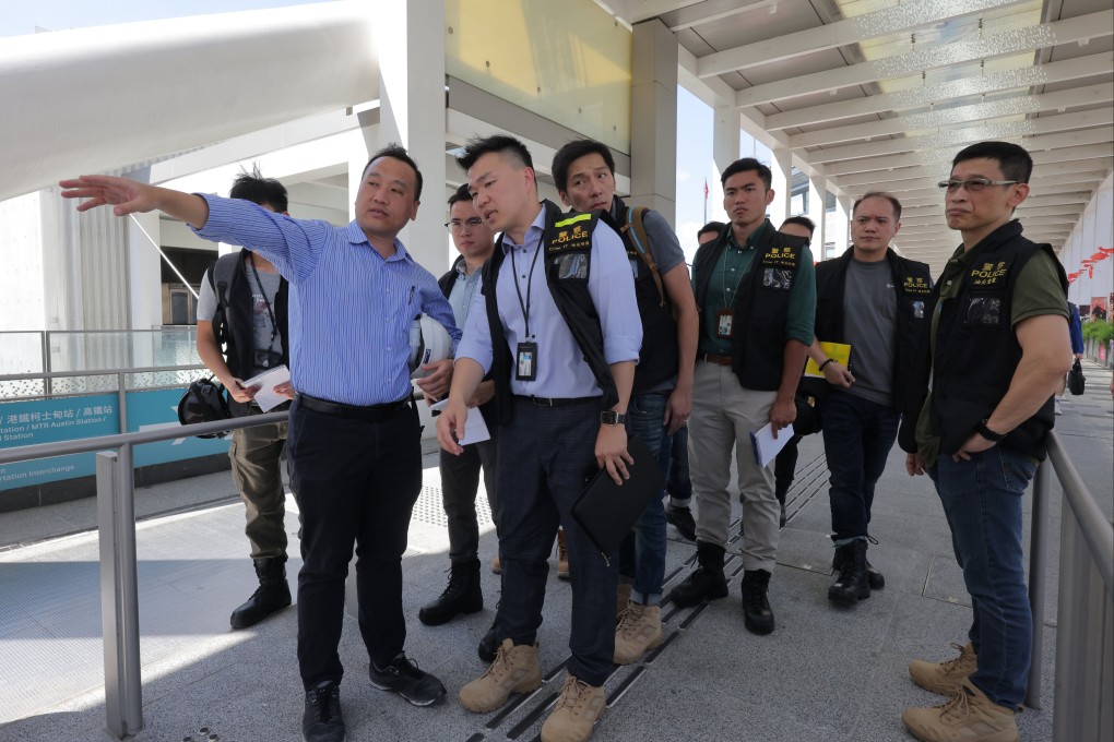 Police officers at the Austin Road West construction site in Yau Ma Tei where two workers died after being trapped in a biogas-filled underground tube for over 12 hours. Photo: Jelly Tse