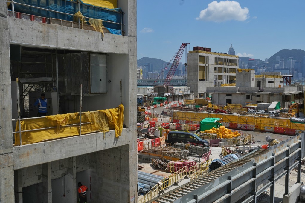 Construction workers work in the site of Hong Kong’s West Kowloon art hub. Photo: Elson LI
