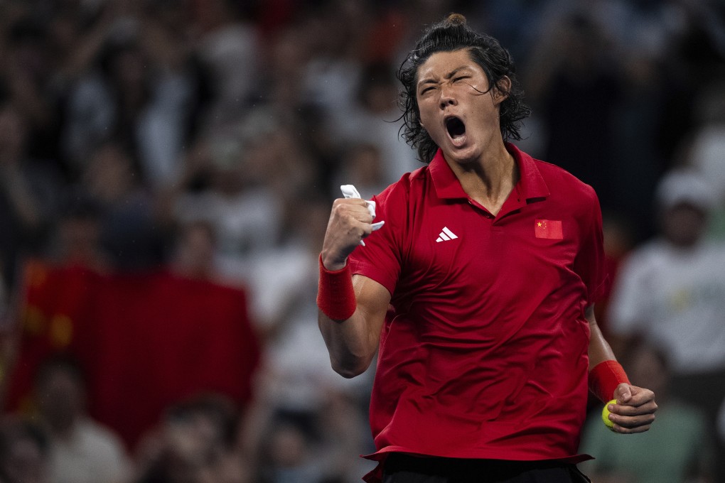 China’s Zhang Zhizhen celebrates after winning the tennis men’s singles final at the 19th Asian Games. Photo: AP