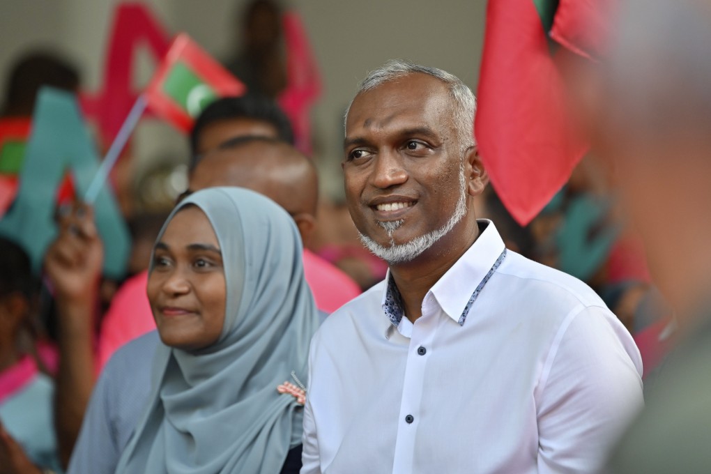 Maldives’ main opposition candidate Mohamed Muiz (right) participates in a rally in Male on Friday. Photo: AP