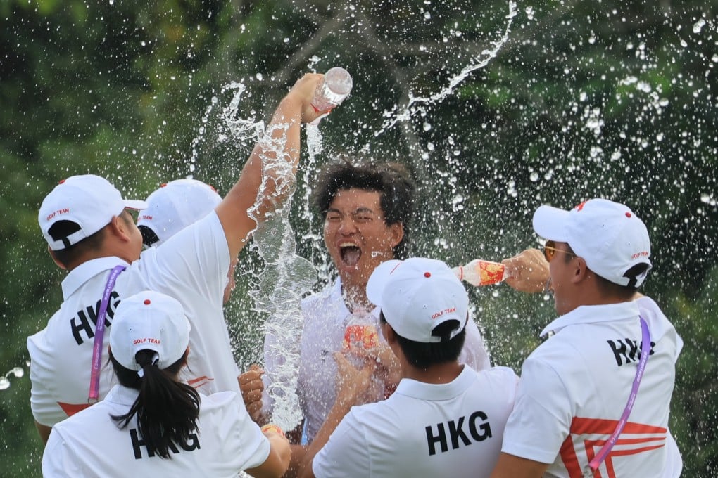 Hong Kong’s Taichi Kho (centre) celebrates with teammates after winning gold in the men’s individual golf tournament. Photo: Dickson Lee