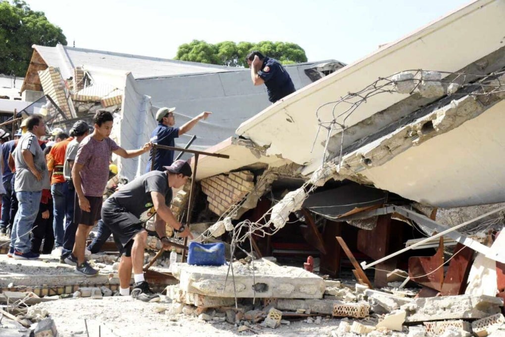 Rescuers search for survivors amid debris after the roof of a church collapsed during a Sunday Mass in Ciudad Madero, Mexico. Photo: Handout/AP