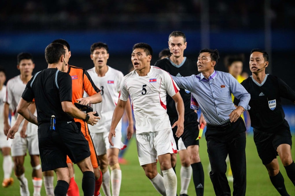 North Korea’s furious footballers aggressively confronted referee
Rustam Lutfullin after their Asian Games exit. Photo: Philip Fong/AFP.