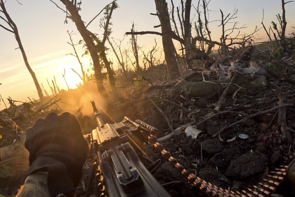 A Ukrainian fighter fires machine gun towards Russian positions near Andriivka, Donetsk region, Ukraine. Photo: AP