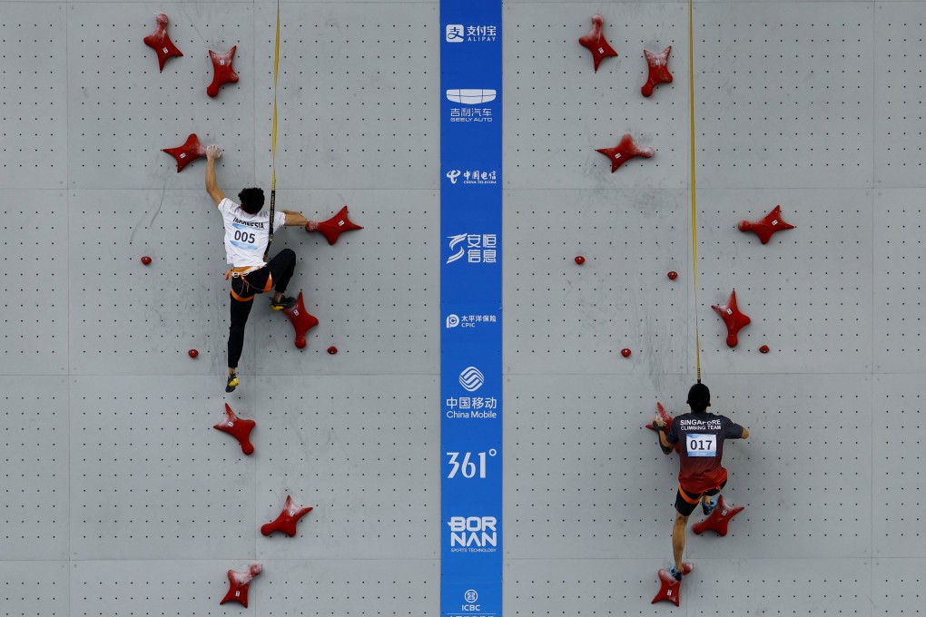 Indonesia’s Veddriq Leonardo (left) and Singapore’s Bing Qian Tan in action during the men’s speed qualification. Photo: Reuters