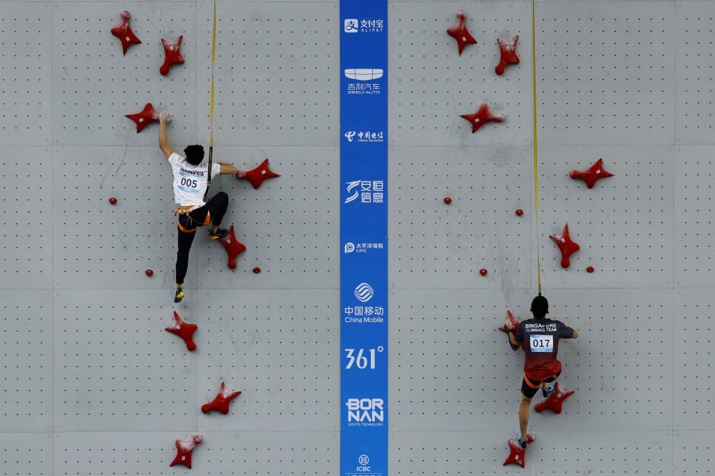 Indonesia’s Veddriq Leonardo (left) and Singapore’s Bing Qian Tan in action during the men’s speed qualification. Photo: Reuters