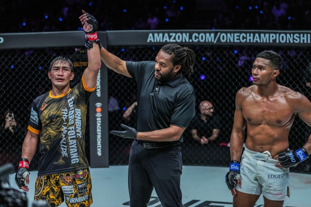 Referee Herb Dean raises Eduard Folayang’s arm after his third-round KO of Amir Khan. Photos: ONE Championship