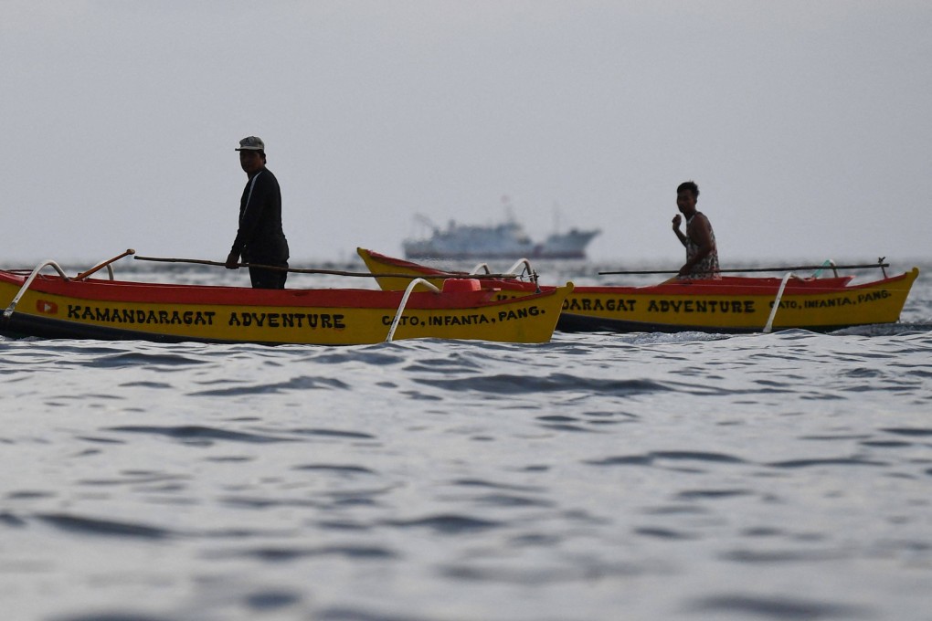 Filipino fishermen working in disputed waters of the South China Sea last month. Photo: AFP