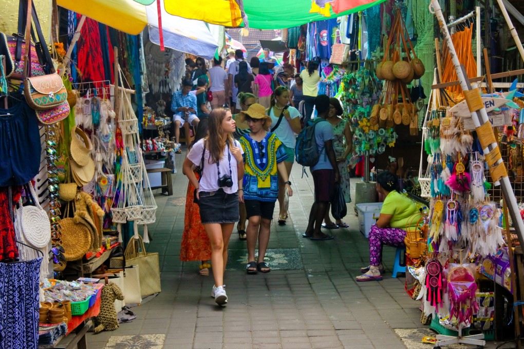 Tourists shopping at Ubud Market in Bali Island Indonesia. Tourism, a large sector in Southeast Asian economies, is one of several fields being affected by China’s property crisis. Photo: Shutterstock