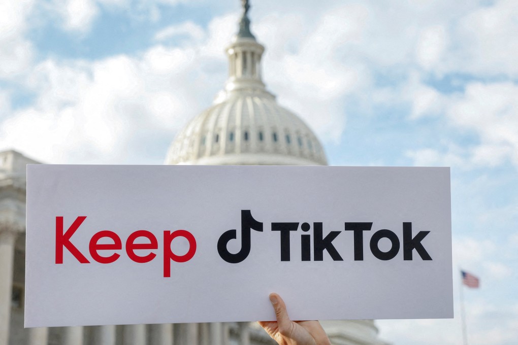 A sign is held up in front of the US Capitol as TikTok creators hold a news conference to speak out against a possible ban on the app in March. Photo: Reuters