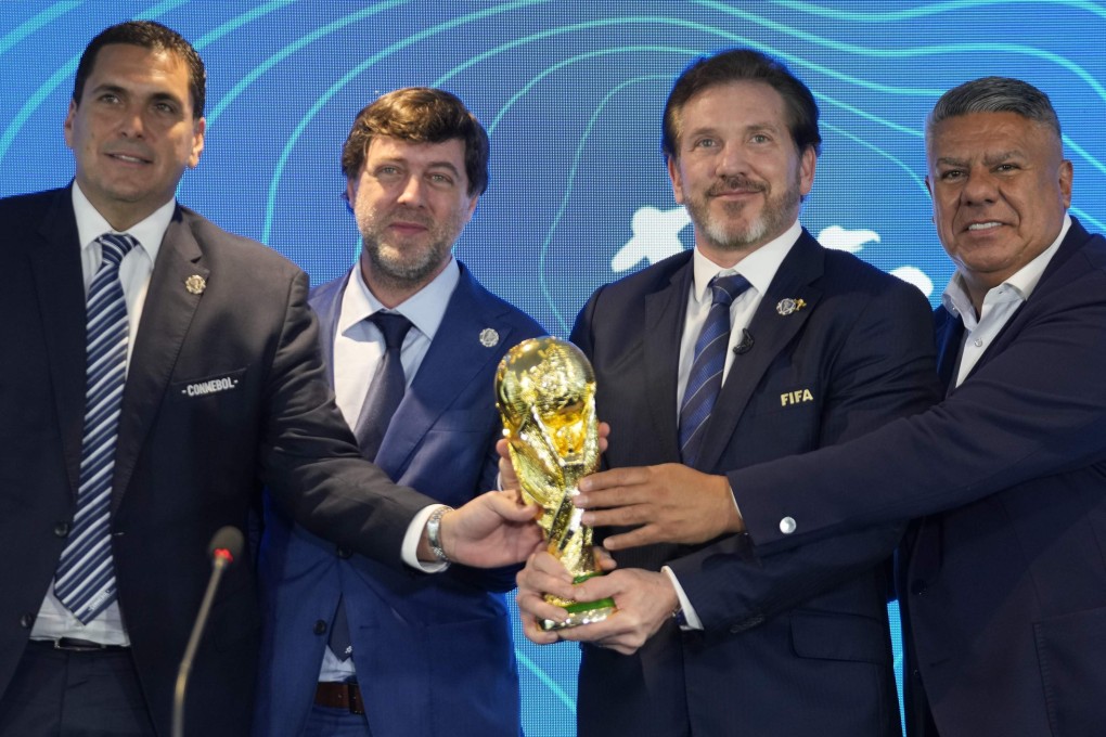 (From left) Paraguay’s Soccer Association President Robert Harrison, Fifa delegate Ignacio Alonso, Conmebol President Alejandro Dominguez and Conmebol Vice-President Claudio Tapia hold the World Cup trophy in Luque, Paraguay on Wednesday. Photo: AP