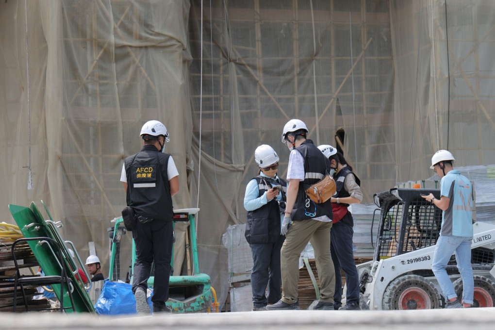 Officers from the Agriculture, Fisheries and Conservation Department at the construction site where the boar attack occurred. Photo: Jelly Tse